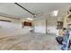 Spacious garage with a utility sink, water heater and side door access at 318 Lookout Dr, Apollo Beach, FL 33572