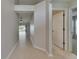 Bright hallway with tile flooring leading to the living area and bedrooms at 318 Lookout Dr, Apollo Beach, FL 33572