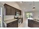 Kitchen has granite countertops, stainless steel appliances and view into living area at 318 Lookout Dr, Apollo Beach, FL 33572