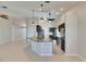 Modern kitchen featuring granite countertops, stainless steel appliances, tile backsplash and recessed lighting at 318 Lookout Dr, Apollo Beach, FL 33572