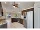 Open kitchen has stainless steel appliances, granite countertops, and is open to the living area at 318 Lookout Dr, Apollo Beach, FL 33572