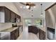 The kitchen features granite countertops, stainless steel appliances, a ceiling fan and recessed lighting at 318 Lookout Dr, Apollo Beach, FL 33572