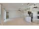 Spacious living room with tile floors, ceiling fans and open layout to kitchen and dining areas at 318 Lookout Dr, Apollo Beach, FL 33572