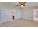 Main bedroom with a ceiling fan and view into ensuite bathroom at 318 Lookout Dr, Apollo Beach, FL 33572