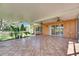 The spacious screened in porch has tile floor and exterior access at 318 Lookout Dr, Apollo Beach, FL 33572