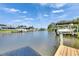 A tranquil waterfront view of the canal, with various docks and boat lifts, creating a serene coastal living experience at 318 Lookout Dr, Apollo Beach, FL 33572