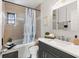 Bathroom with a shower/tub combo, updated vanity with countertop, and a framed mirror at 3201 36Th N Ave, St Petersburg, FL 33713