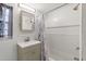 Bathroom features a shower and a sink with storage below at 3201 36Th N Ave, St Petersburg, FL 33713