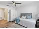 Bedroom with ceiling fan, closet, and a view to bathroom at 3201 36Th N Ave, St Petersburg, FL 33713