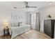 Bedroom featuring a ceiling fan, a window with curtains, a drawer, and decorations at 3201 36Th N Ave, St Petersburg, FL 33713
