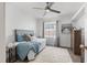 Bedroom featuring a ceiling fan, a window with curtains and new floor at 3201 36Th N Ave, St Petersburg, FL 33713