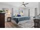 Cozy bedroom featuring a comfortable queen-sized bed, ceiling fan and natural light at 3201 36Th N Ave, St Petersburg, FL 33713