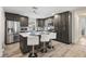 Modern kitchen with stainless steel appliances, kitchen island, and bar stool seating at 3201 36Th N Ave, St Petersburg, FL 33713