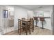 Eat-in kitchen with breakfast bar and stainless steel sink on the left at 3201 36Th N Ave, St Petersburg, FL 33713