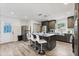 Modern kitchen with stainless steel appliances, kitchen island, and bar stool seating at 3201 36Th N Ave, St Petersburg, FL 33713