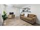 Living room with light wood floors and breakfast bar to kitchen at 3201 36Th N Ave, St Petersburg, FL 33713