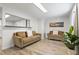 Cozy living room featuring light wood floors and natural light at 3201 36Th N Ave, St Petersburg, FL 33713