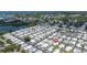 Community aerial view shows proximity to lake, neighborhood layout, and nearby amenities at 3301 Alt 19 # 317, Palm Harbor, FL 34683