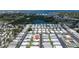 Aerial view of a neighborhood with water in the distance and tightly packed homes at 3301 Alt 19 # 317, Palm Harbor, FL 34683