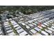 Aerial view of a community with a swimming pool and rows of homes at 3301 Alt 19 # 317, Palm Harbor, FL 34683