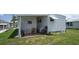 Peaceful backyard with seating and a well-maintained lawn, providing a private outdoor retreat at 3301 Alt 19 # 317, Palm Harbor, FL 34683