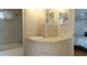 Bright bathroom features tile backsplash, a clean sink, and plenty of storage space at 3301 Alt 19 # 317, Palm Harbor, FL 34683