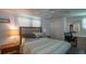 Bedroom with a desk and sliding door closet, and ceiling fan at 3301 Alt 19 # 317, Palm Harbor, FL 34683