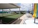 Bocce ball court with benches, outdoor tables, and umbrellas provide recreation in the community at 3301 Alt 19 # 317, Palm Harbor, FL 34683