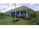Well-maintained exterior with covered porch and lush landscaping at 3301 Alt 19 # 317, Palm Harbor, FL 34683