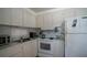 Bright kitchen features modern appliances and ample countertop space at 3301 Alt 19 # 317, Palm Harbor, FL 34683