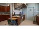 Galley kitchen features stainless hood, tile backsplash, wood cabinets and modern appliances at 3301 Alt 19 # 317, Palm Harbor, FL 34683