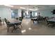 Large meeting room with tables and chairs provides ample space for community gatherings at 3301 Alt 19 # 317, Palm Harbor, FL 34683