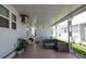Cozy, covered patio area with comfortable seating, perfect for relaxing and enjoying the outdoors at 3301 Alt 19 # 317, Palm Harbor, FL 34683