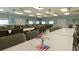 Recreation room features many tables with chairs, flags, and bright natural light at 3301 Alt 19 # 317, Palm Harbor, FL 34683