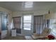 Relaxing sun room offers natural light and comfortable seating at 3301 Alt 19 # 317, Palm Harbor, FL 34683