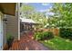 Well-maintained backyard with a wooden deck and screened-in porch, ideal for enjoying the outdoors at 344 Cascade Ln, Palm Harbor, FL 34684