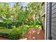 Inviting backyard featuring a spacious wood deck and lush landscaping, creating a serene outdoor retreat at 344 Cascade Ln, Palm Harbor, FL 34684