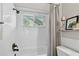 Bright bathroom featuring a white subway tile shower with a dark rainfall shower head at 344 Cascade Ln, Palm Harbor, FL 34684