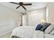 Bedroom with carpet flooring, ceiling fan and closet space at 344 Cascade Ln, Palm Harbor, FL 34684