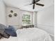 Bedroom featuring ceiling fan, desk area and natural lighting at 344 Cascade Ln, Palm Harbor, FL 34684