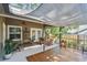Inviting covered patio with ceiling fans, perfect for outdoor gatherings and relaxation at 344 Cascade Ln, Palm Harbor, FL 34684
