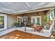 Charming covered patio with ceiling fans, providing a comfortable and shaded outdoor dining and lounging area at 344 Cascade Ln, Palm Harbor, FL 34684