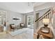 Bright foyer with views to the staircase, backyard through French doors, and seating at 344 Cascade Ln, Palm Harbor, FL 34684