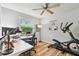 Spacious home gym featuring exercise equipment, neutral walls, and a ceiling fan at 344 Cascade Ln, Palm Harbor, FL 34684