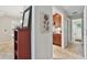 Hallway view towards a kitchen and bathroom, complemented by tile flooring and warm wall tones at 344 Cascade Ln, Palm Harbor, FL 34684