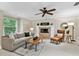 Cozy living room featuring a fireplace, comfortable seating, and stylish decor at 344 Cascade Ln, Palm Harbor, FL 34684