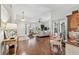 Spacious living room featuring hardwood floors, vaulted ceilings, and a comfortable seating area near French doors at 344 Cascade Ln, Palm Harbor, FL 34684