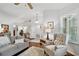 Well-lit living room showcasing hardwood floors, a plush armchair, and soft lighting at 344 Cascade Ln, Palm Harbor, FL 34684