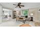 Spacious living room leading to the dining area, featuring neutral tones and stylish decor at 344 Cascade Ln, Palm Harbor, FL 34684