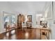 Open living area with hardwood floors and patio access; showcasing a blend of traditional and contemporary decor at 344 Cascade Ln, Palm Harbor, FL 34684